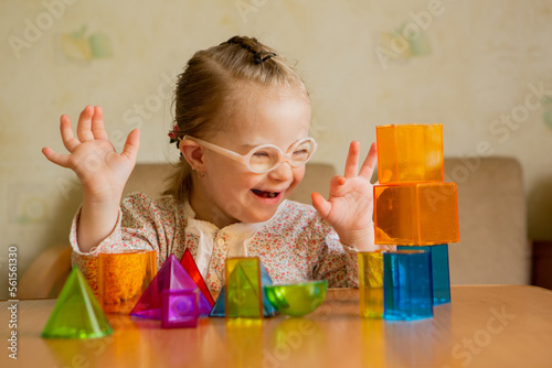 A girl with Down's syndrome lays out geometric shapes