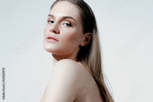 Beautiful caucasian girl with perfect skin and natural makeup on white background