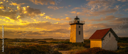 Wood End Lighthouse in Provincetown on Cape Cod, Massachusetts, USA, oceanside beach seascape at golden sunset