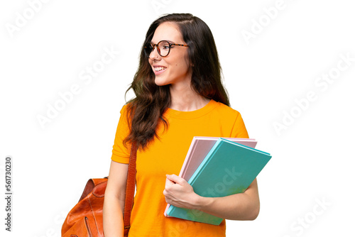 Young student caucasian woman over isolated background looking to the side and smiling