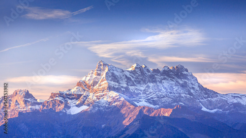 Sinrise or sunset panoramic banner view of the Dents du Midi in the Swiss Alps, canton Vaud, Switzerland