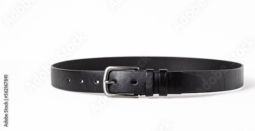 Black leather belt for trousers and jeans. Fastened fashionable men leather belt with dark chrome matted metal buckle isolated on white background. Male accessory. Luxury strap. Haberdashery goods