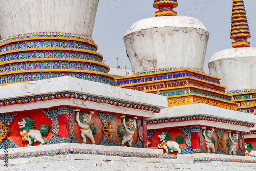 Figures and painting on a Tibetan stupa at the impressive Ta'er Monastery near Xining, China
