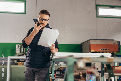 Worker talks on the phone with a costumer