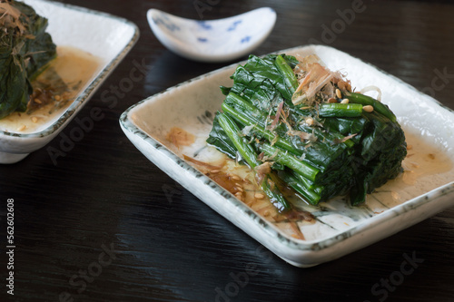 Spinach Ohitashi is an easy classic Japanese side dish, made of blanched spinach steeped in light dashi soy broth and garnished with bonito.