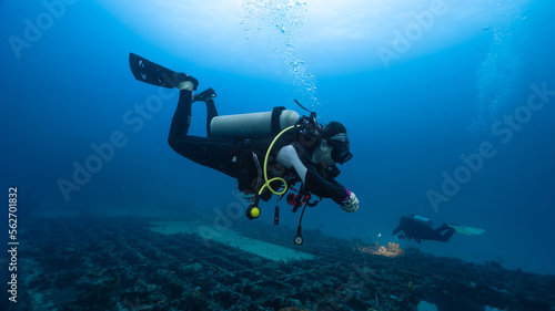 female diver practicing deep diving skills
