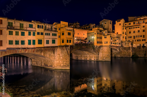 Ponte Vecchio bridge with silversmith shops on Arno at sunset, Florence, Italy