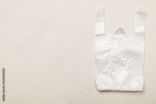 Plastic bag on concrete background, top view