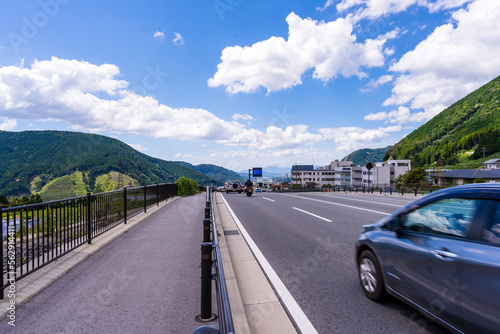 観光名所「新阿蘇大橋・国道57号線から観える市街地風景」 Sightseeing spot "City view from Shin-Aso Bridge/National Route 57" 日本 Japan 九州・熊本県南阿蘇村(2022年) Kyushu, Minamiaso Village, Kumamoto Prefecture (2022)