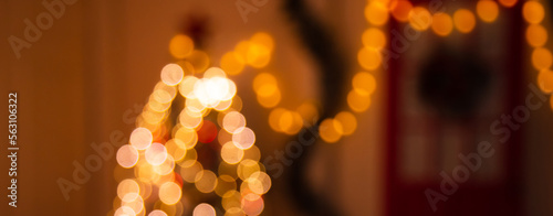 blurred background of lanterns on christmas tree. Christmas bokeh