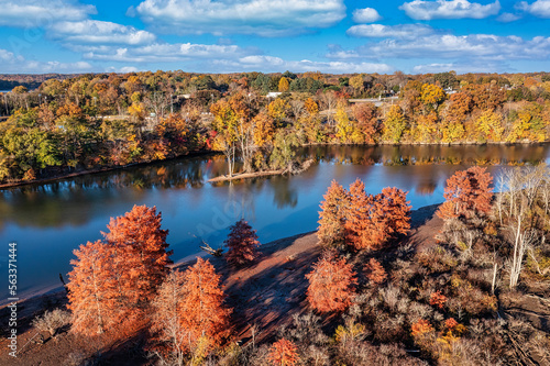 Beautiful colorful autumn day on the Elk River with an island and Estill Springs City Park in the background. Tims Ford lake in Tennessee USA.