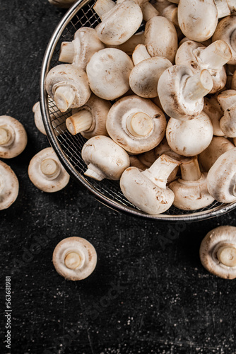 Fresh mushrooms in a colander. 