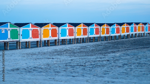 Wildwood New Jersey NJ ocean at night with colorful beach storage on sand landscape perspective
