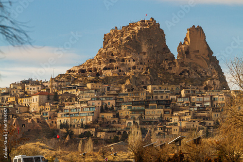 Goreme town on sunset in Cappadocia, Central Anatolia,Turkey. Morning view of the village of Goreme in Cappadocia on the background of the natural terrain
