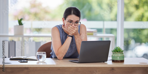 Surprise, mistake or error with a business woman looking shocked while working on a laptop in her office. Computer, glitch and problem with a scared female employee worried about a system failure