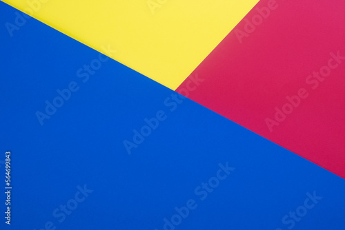 Yellow, blue and red colored cardboards background. Copy space 