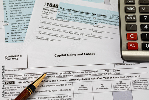 Capital gains form for federal income tax return and calculator. Federal tax return, income tax and tax refund concept