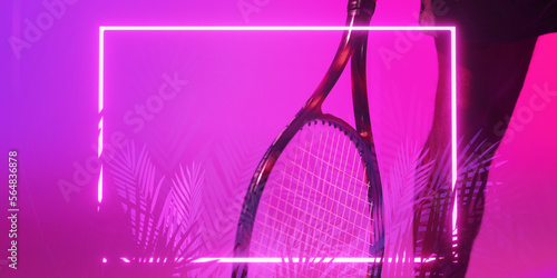 Cropped leg of african american male player with tennis racket over illuminated plants and rectangle