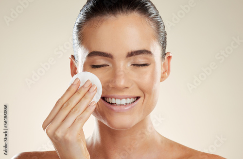 Beauty, skincare and face of woman with cotton for cleaning skin with natural dermatology product. Aesthetic model person happy about makeup remover, facial cosmetics and detox for self care results