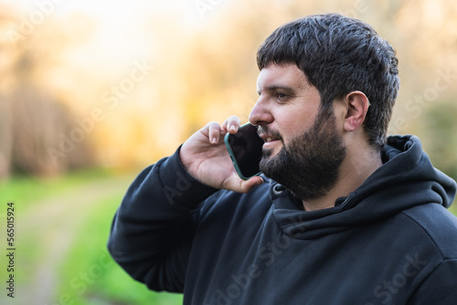 hearing aid man speaks on the phone with hearing aids