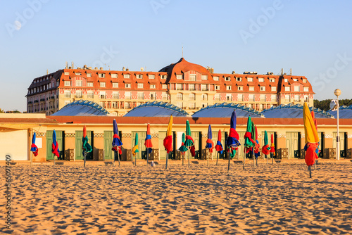 Colorful umbrellas on the sand beach of Deauville, Normandy, France.