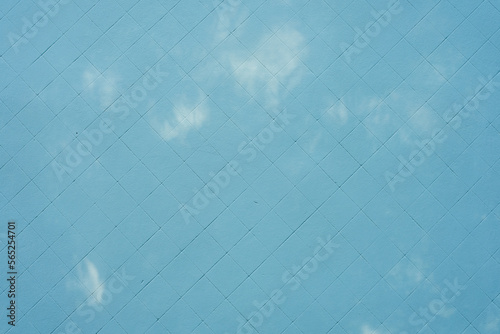 blue painted wall with flashes of light, texture, background