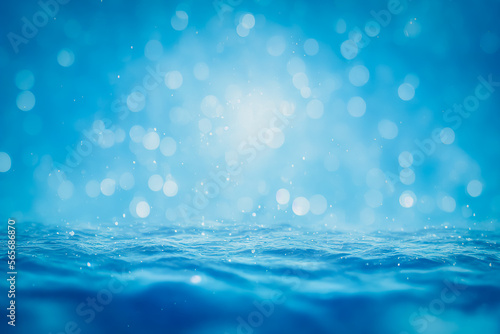 Bright water surface with blue bokeh and glitter effects.