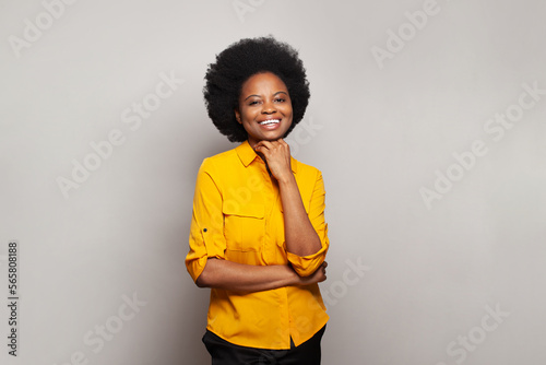 Portrait of charming brunette woman wearing casual yellow clothes smiling on white