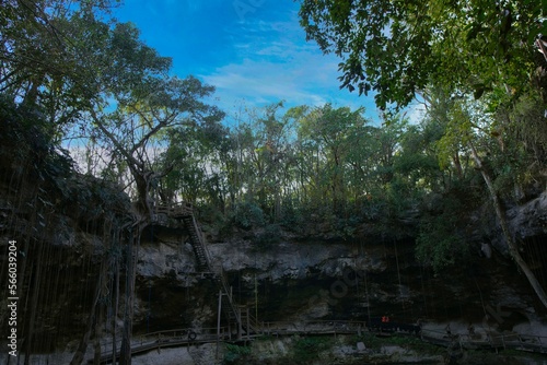 Cenote Xcanche is a stunning open cenote with swimming, zip-lining and swing jumps , there is also a waterfall cascading into the cenote. Located near Valladolid the Yucatan Peninsula , 14 11 2022.