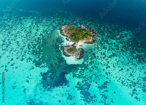 The tropical with seashore island in a coral reef ,blue and turquoise sea Amazing nature landscape with blue lagoon-Above view