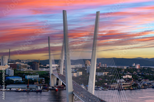 Urban landscape with a view of the Golden Bridge at sunset. Vladivostok, Russia