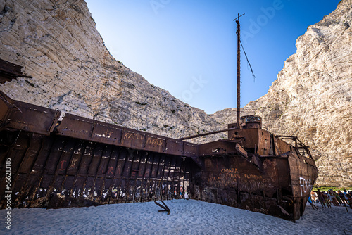 Fantastic view of the old rusty shipwreck stranded on the beach of Navagio (Smugglers Cove) on Zakynthos island in Greece, surrounded by high cliffs