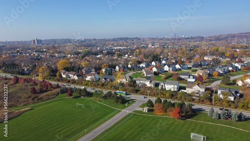 Large soccer fields near upscale residential neighborhood in Monroe County with downtown Rochester, Upstate New York in background