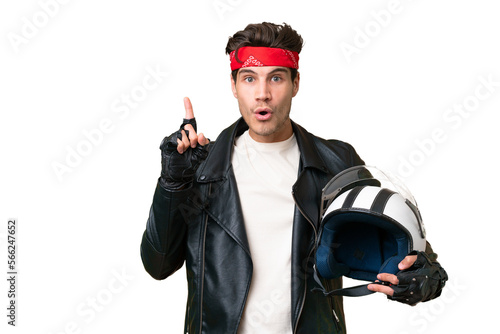 Young caucasian man with a motorcycle helmet over isolated background intending to realizes the solution while lifting a finger up