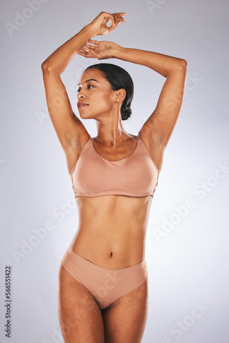 Body, underwear and woman isolated on studio background for body skincare, wellness beauty and weight results health. Lingerie, fashion and model or person stomach, dermatology and aesthetic mockup
