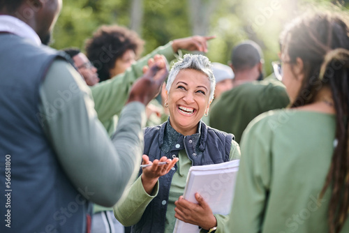 Volunteer, team and people in nature for community service, teamwork and planning with leadership, goals and strategy. Senior person or leader for management in forest, park or eco friendly project