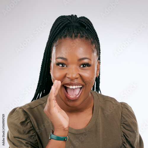 Portrait, announcement and excited with a black woman in studio on a gray background to share news. Hands, promotion and information with a young female indoor sharing a secret as a brand ambassador