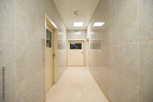 corridor in a hospital with manually closed door and LED lighting