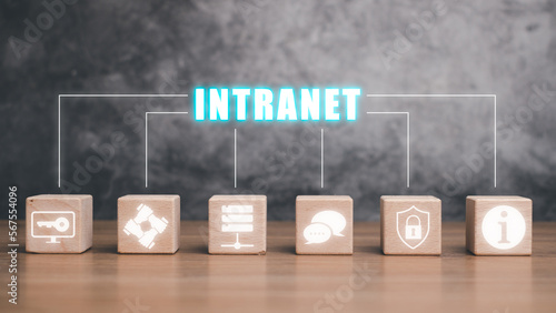 Intranet concept, Wooden block cube on desk with intranet icon on virtual screen.