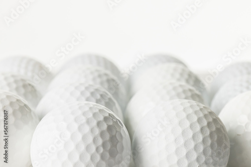 Close up of white golf balls with copy space on white background