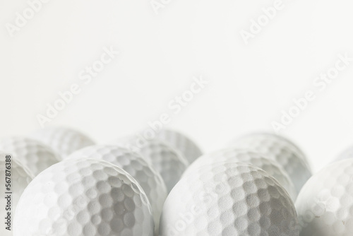 Close up of white golf balls with copy space on white background