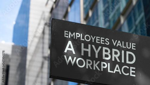 Employees value a hybrid workplace on a black city-center sign in front of a modern office building 