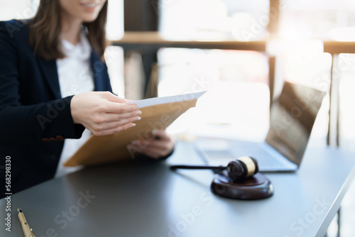 Portrait of a Asian woman lawyer studying a lawsuit for a client before going to court