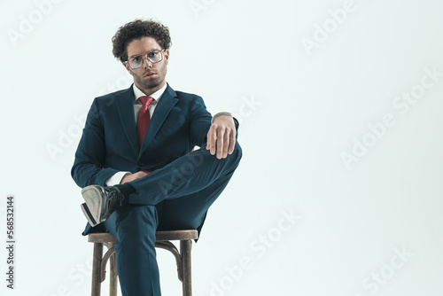 businessman with tough attitude crossing legs
