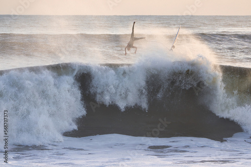 Surfers wiping out on giant waves in Santa Barbara California