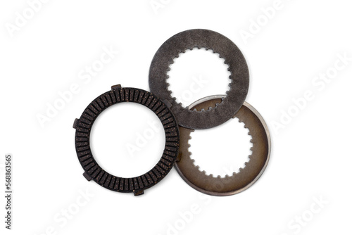 Spare part of motorcycle clutch plate isolated on white background.
