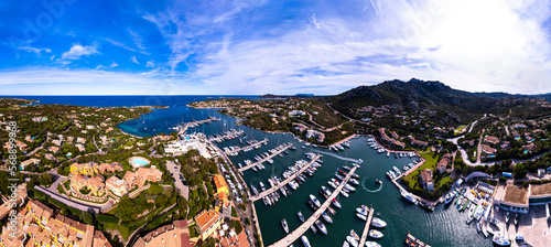 Italy, Sardegna island. Luxury resort Porto Cervo. Marina with sailing boats, aerial drone video view