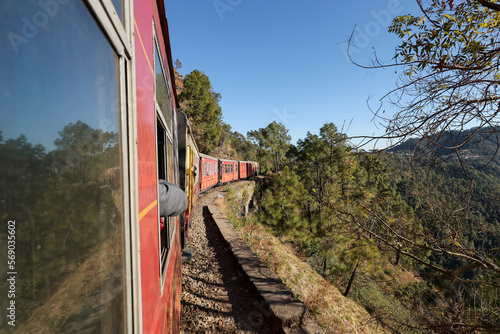 Toy train running from Kalka to Shimla or Simla capital of Himachal Pradesh north India Himalayas. Indian mountain railway 