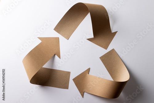 Close up of recycling symbol of carton arrows on white background with copy space