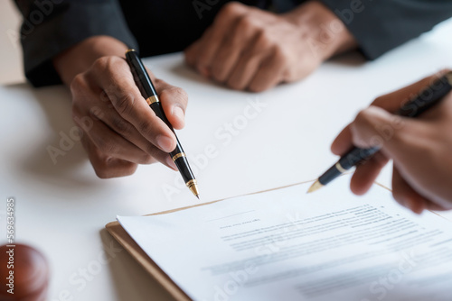 Lawyer and client sign variou financial legal contract to mediate with the legal execution department and make appointment for client to mediate debt settlement agreement.